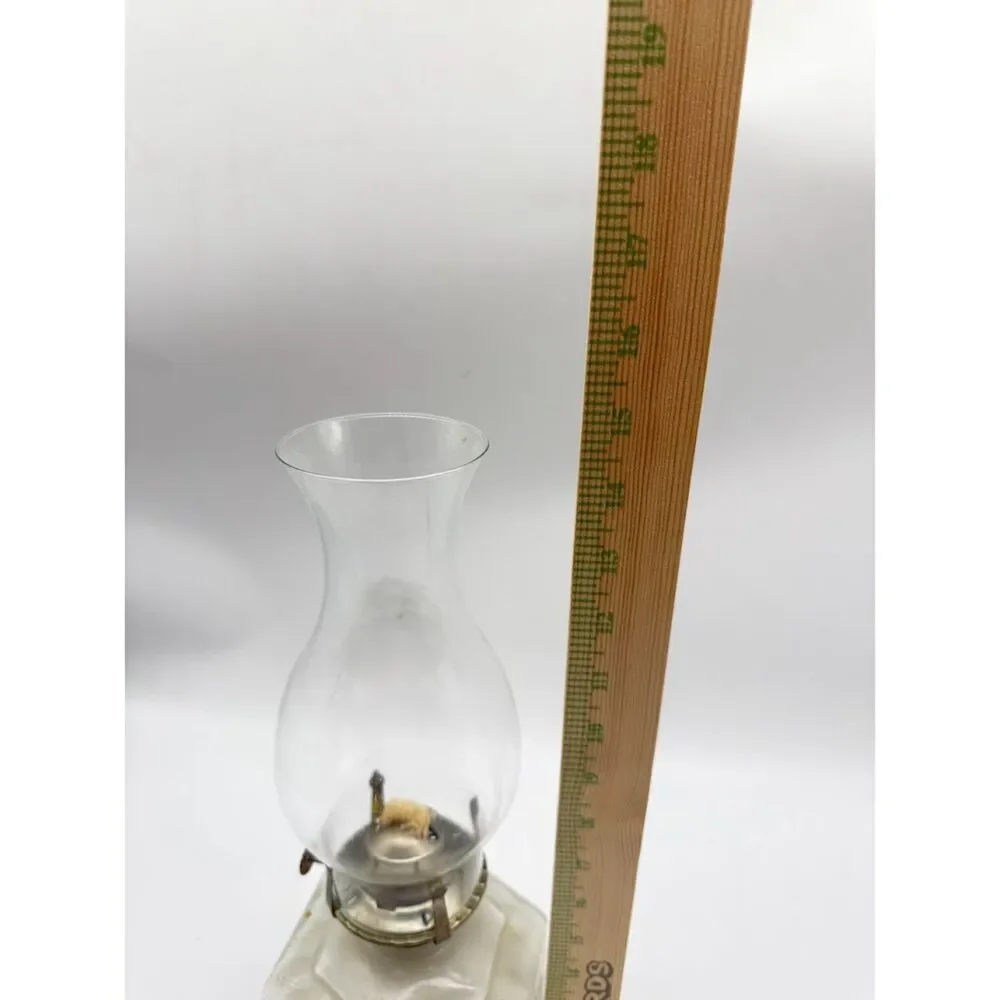 vintage oil lamp featuring a hexagonal base embossed  a horse and buggy scene
